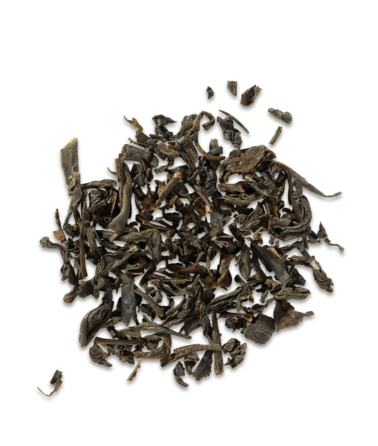 Dry black tea leaves on a white background